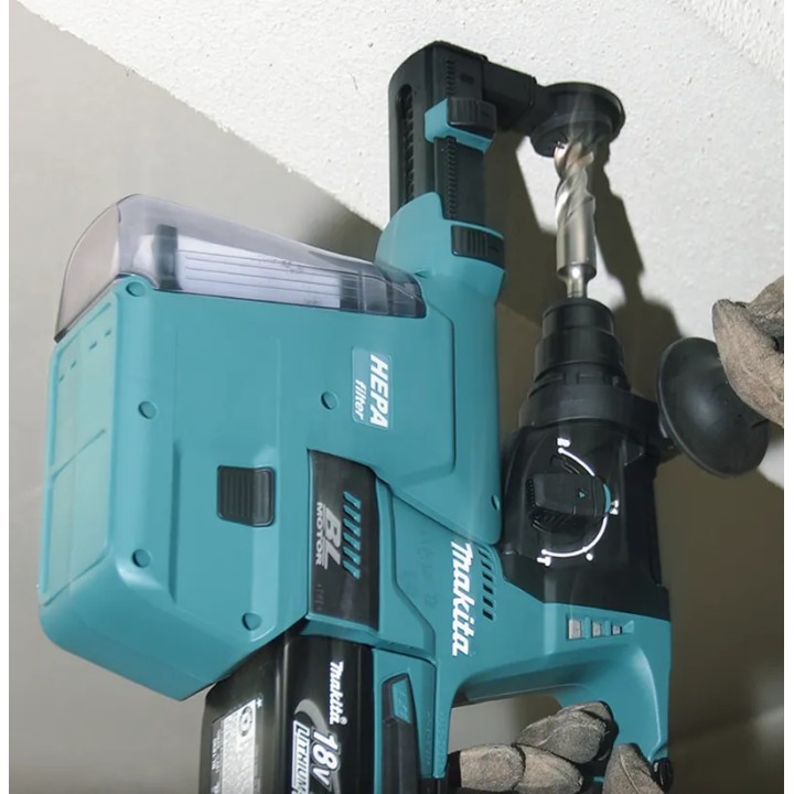 Vista dettaglio corpo macchina e pulsante di inversione del tassellatore